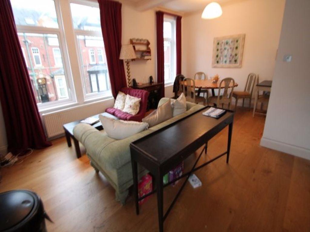 A bright and welcoming living room featuring a ...