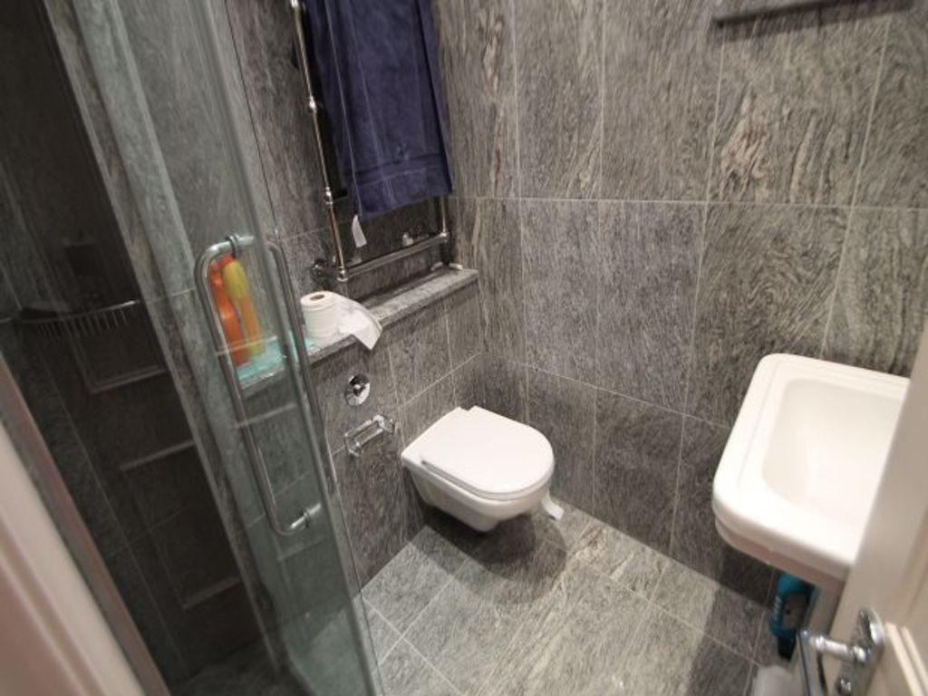 A clean and functional bathroom with a washing ...