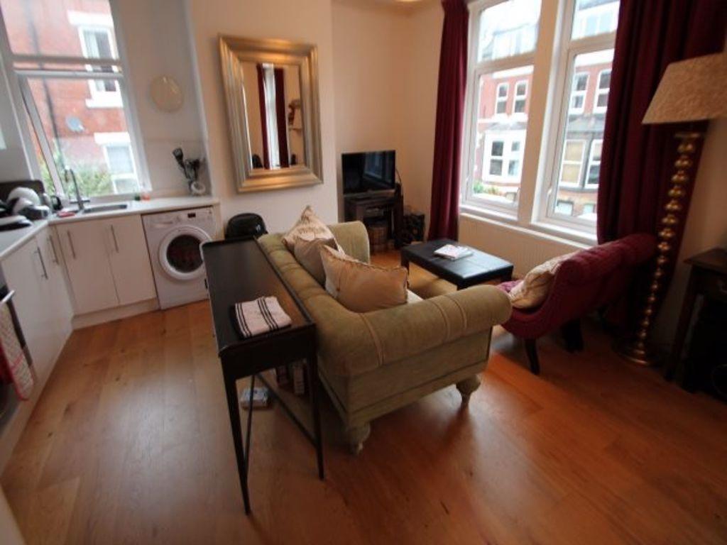 Bright and welcoming living room featuring larg...