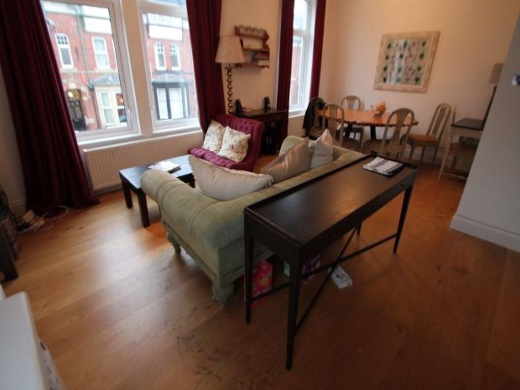 A bright and inviting living room with large wi...