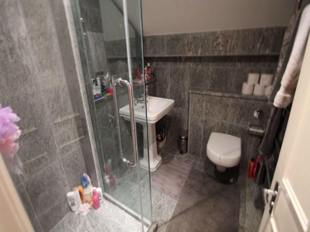 Bright and well-maintained bathroom with modern...
