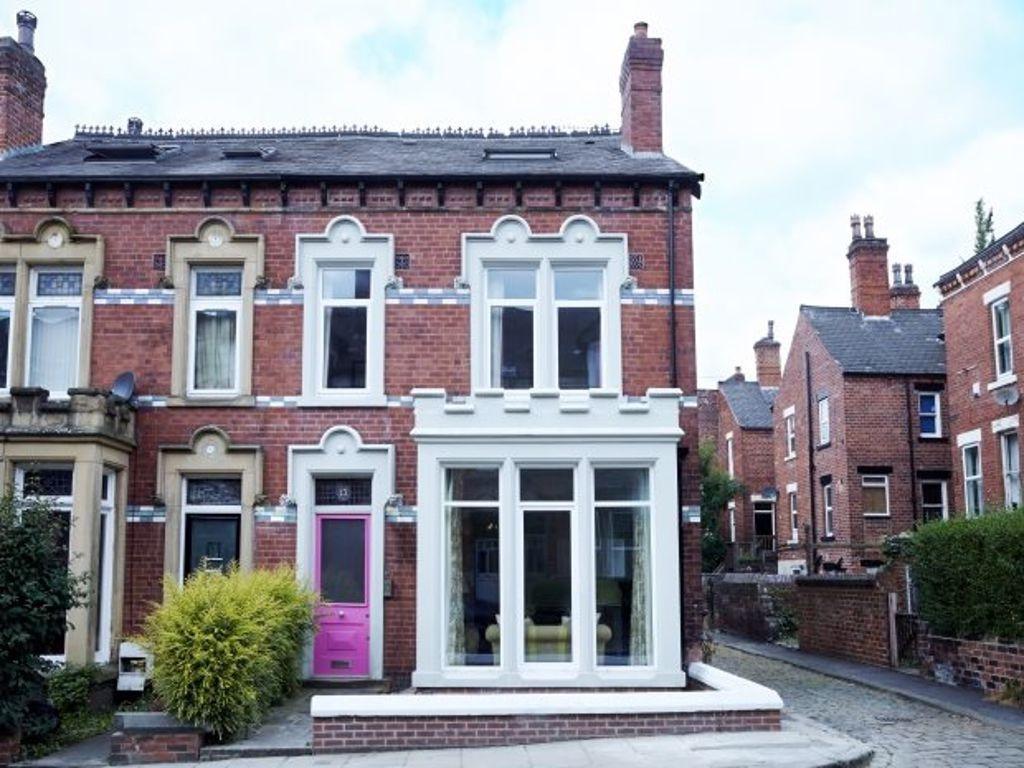 A charming Victorian-style house with well-main...