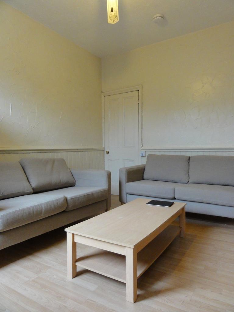 A spacious and inviting living room featuring t...