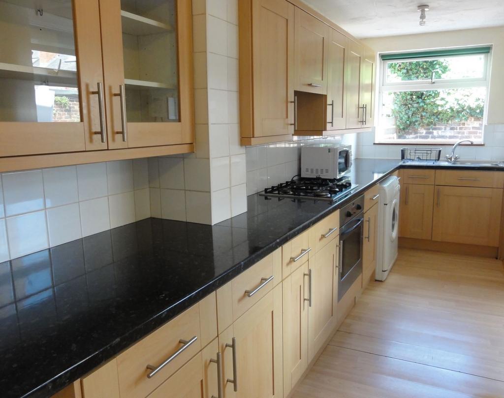 Bright and clean kitchen with ample natural lig...