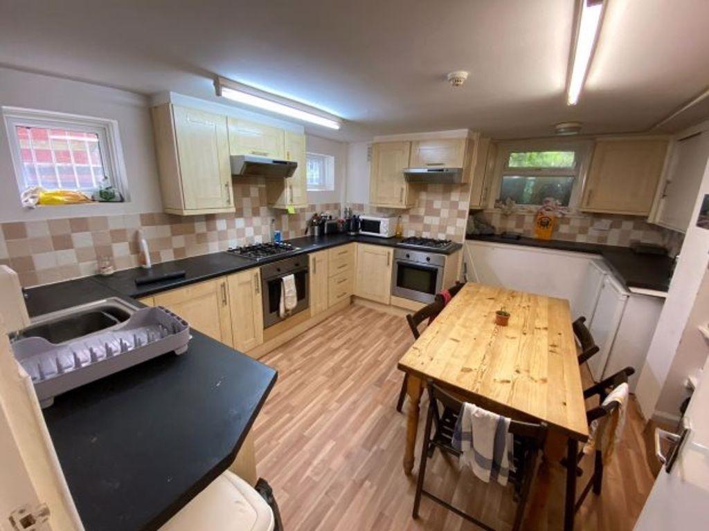 A bright and well-maintained kitchen with ample...