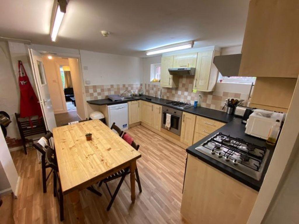 A well-maintained kitchen featuring a large din...