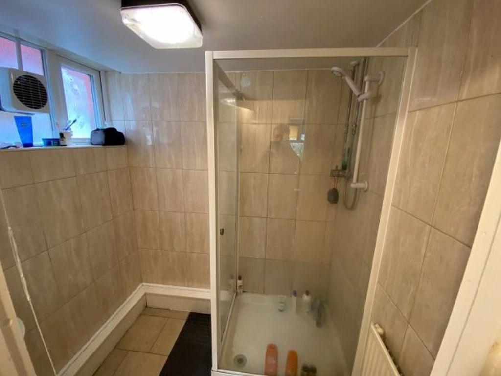 A clean and well-maintained bathroom with a spa...