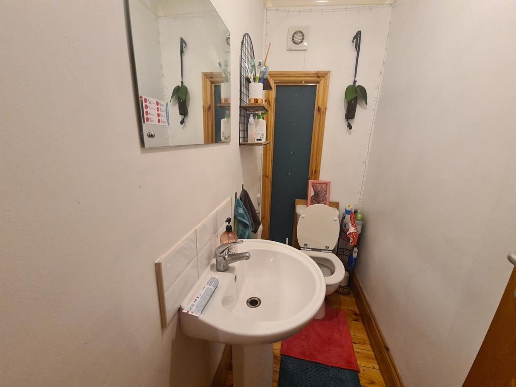 A spacious and well-maintained bathroom with a ...