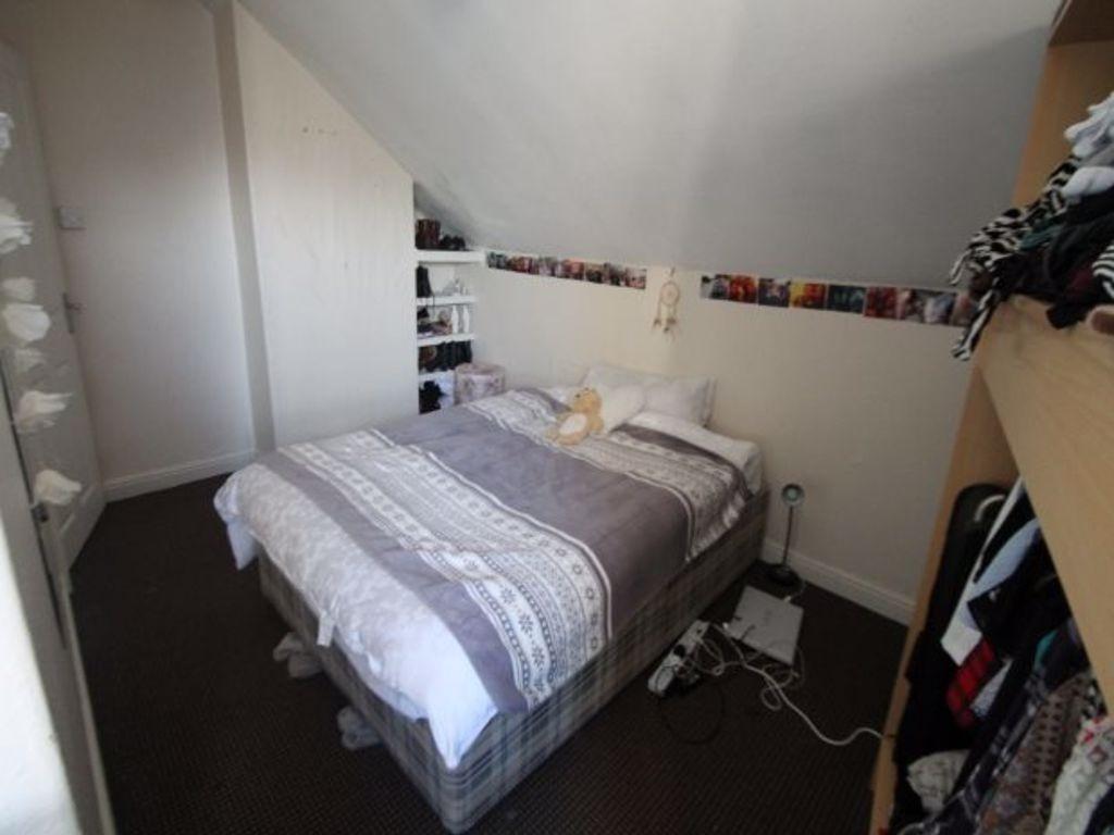 A spacious master bedroom featuring a large dou...