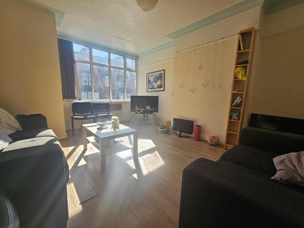 A bright and spacious living room filled with n...