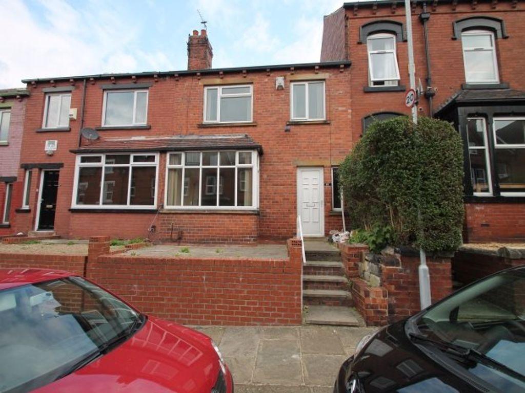 A charming red-brick house front with well-main...