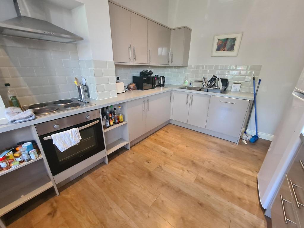 Bright and modern kitchen featuring ample count...
