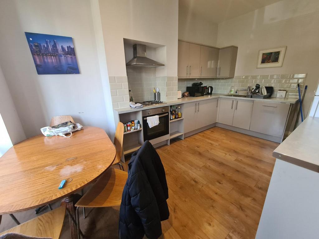 Bright and modern kitchen featuring ample count...