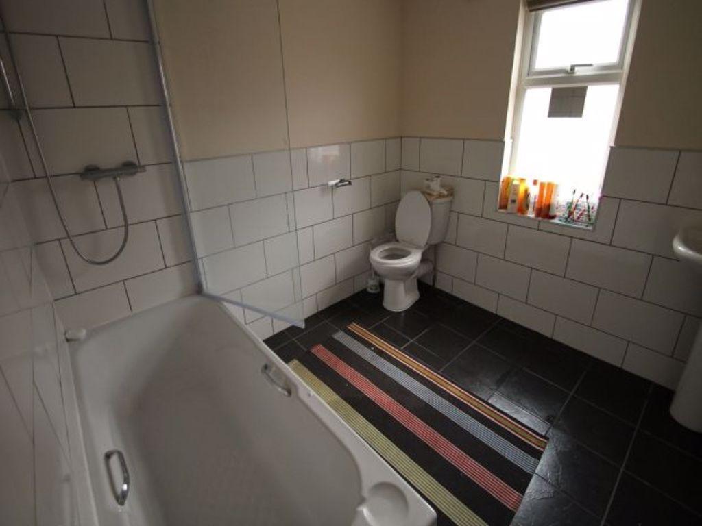 A clean and well-maintained bathroom with a lar...