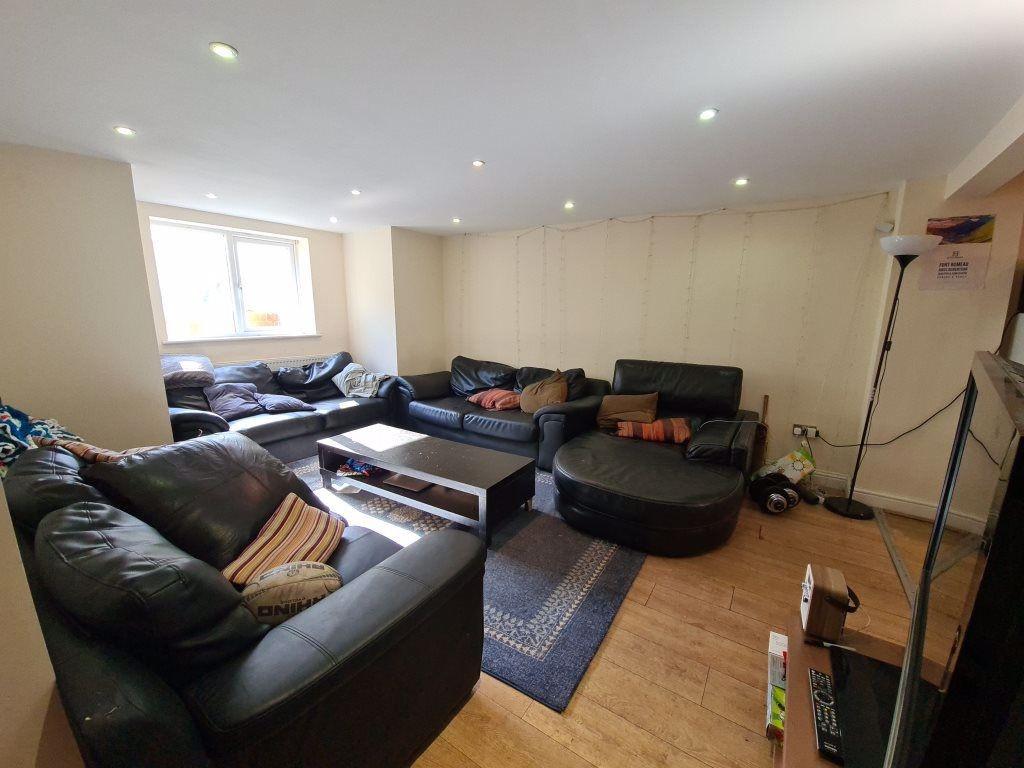 Spacious and modern living room with ample seat...
