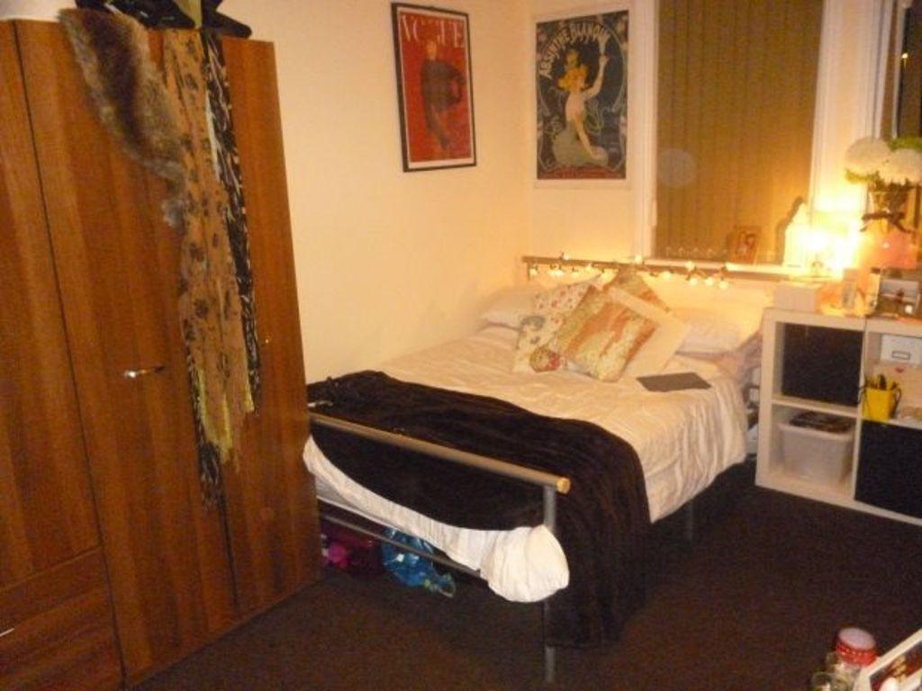 A well-presented master bedroom featuring a lar...