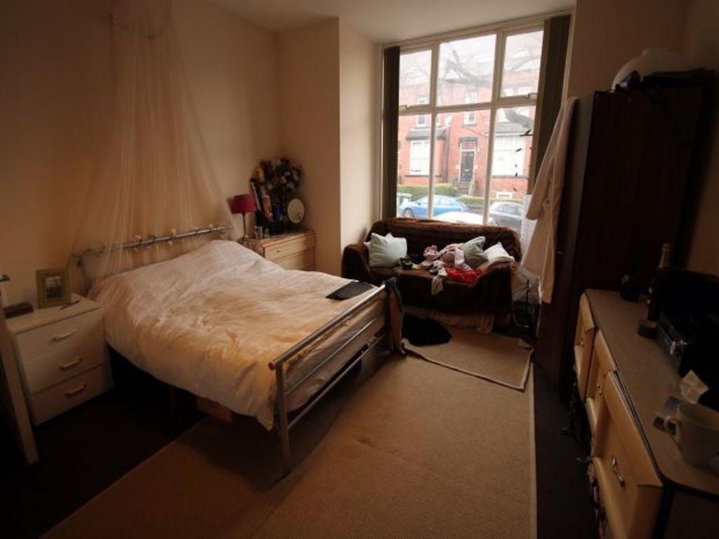 A spacious and inviting master bedroom with a l...