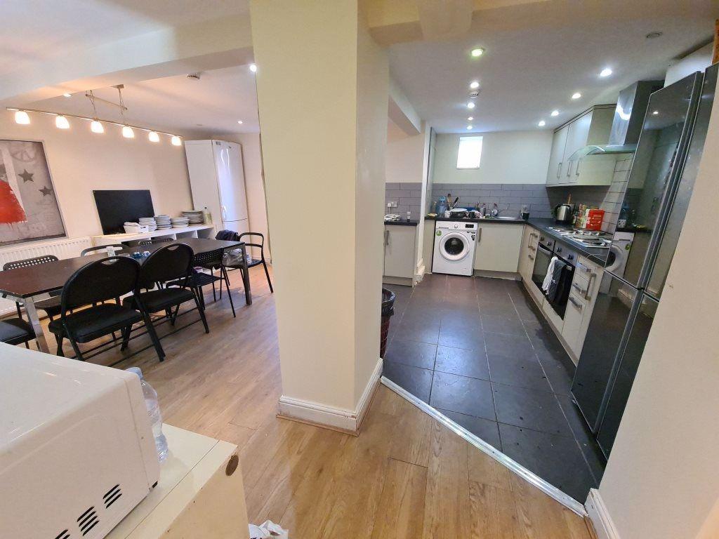 A modern, well-lit kitchen with sleek cabinetry...