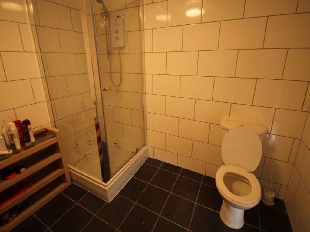 A modern bathroom featuring a large shower encl...