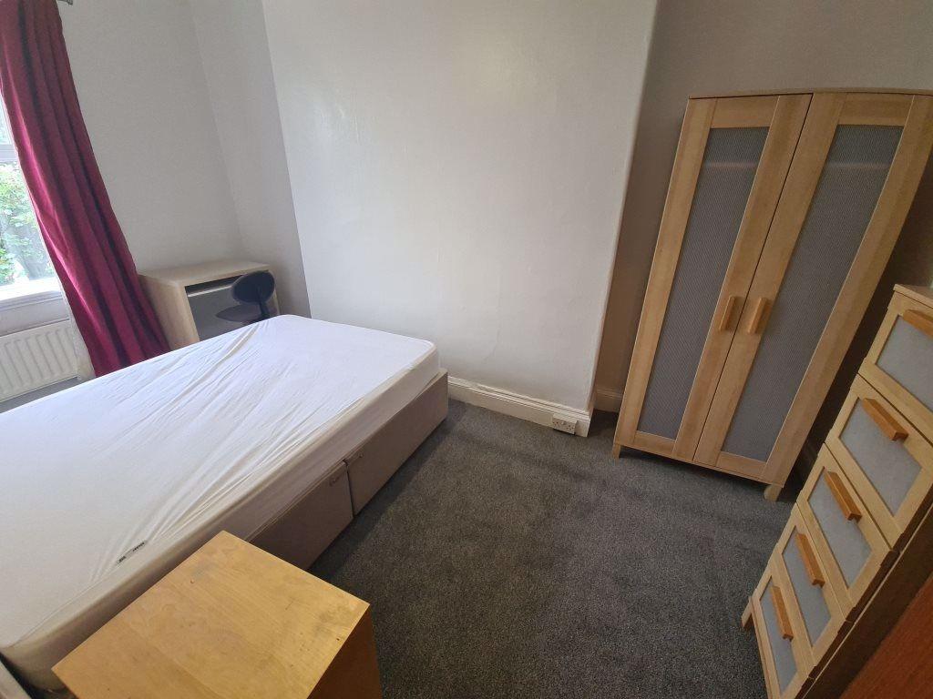 A bright and inviting double bedroom featuring ...