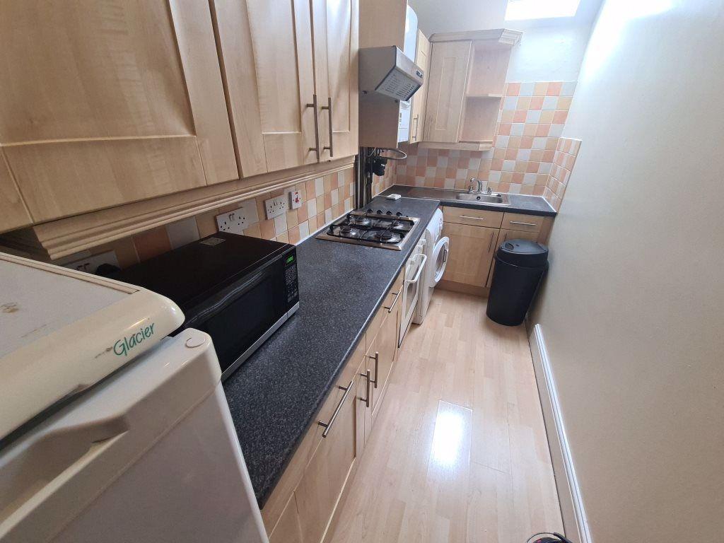 A well-maintained kitchen with ample workspace ...