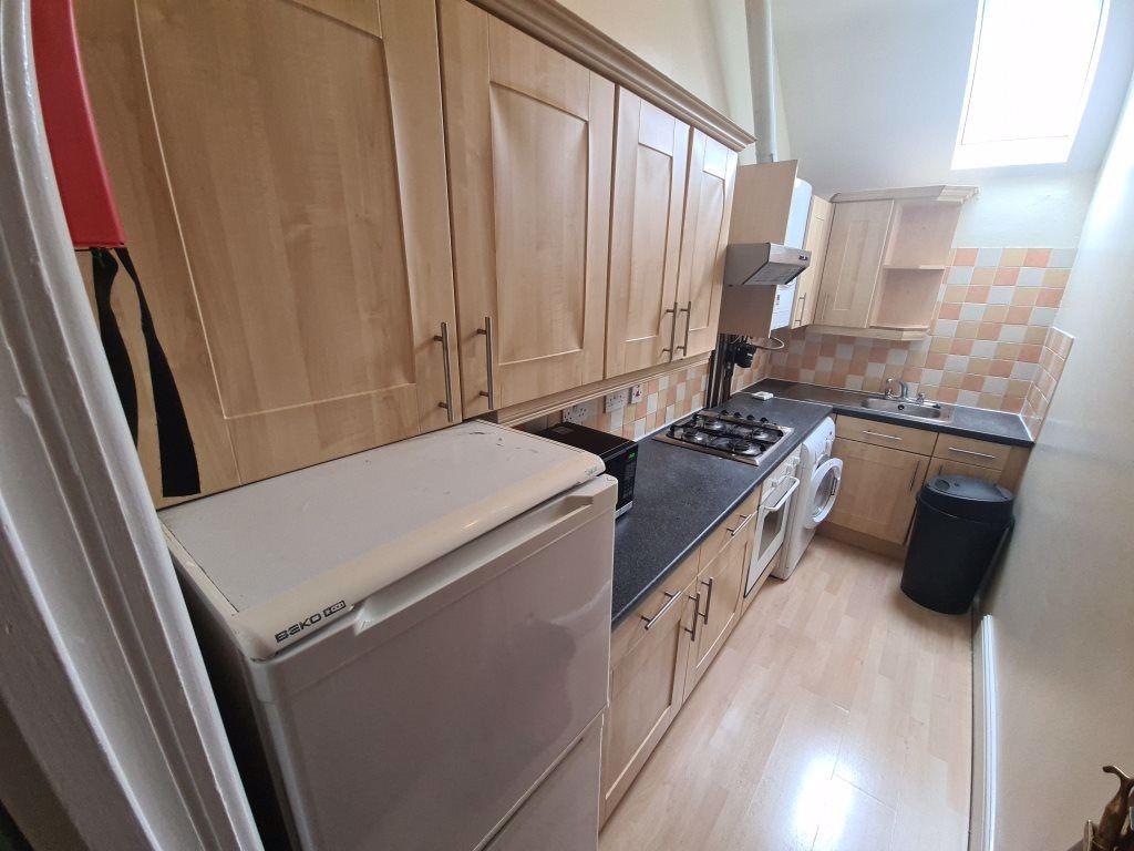 A compact, well-maintained kitchen with ample n...