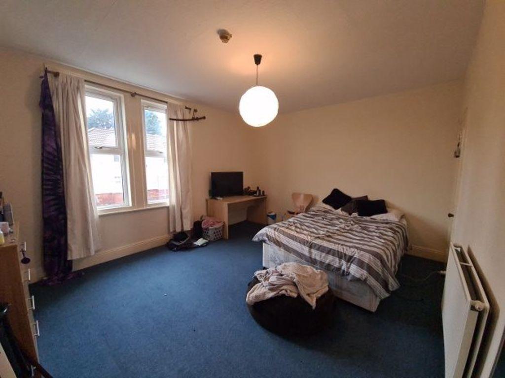 A welcoming bedroom featuring a comfortable dou...