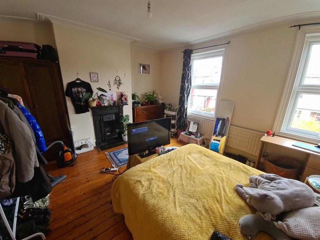 A spacious and inviting living room featuring a...