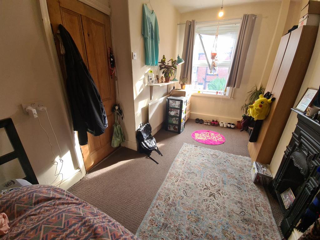 A cozy bedroom with natural light streaming thr...
