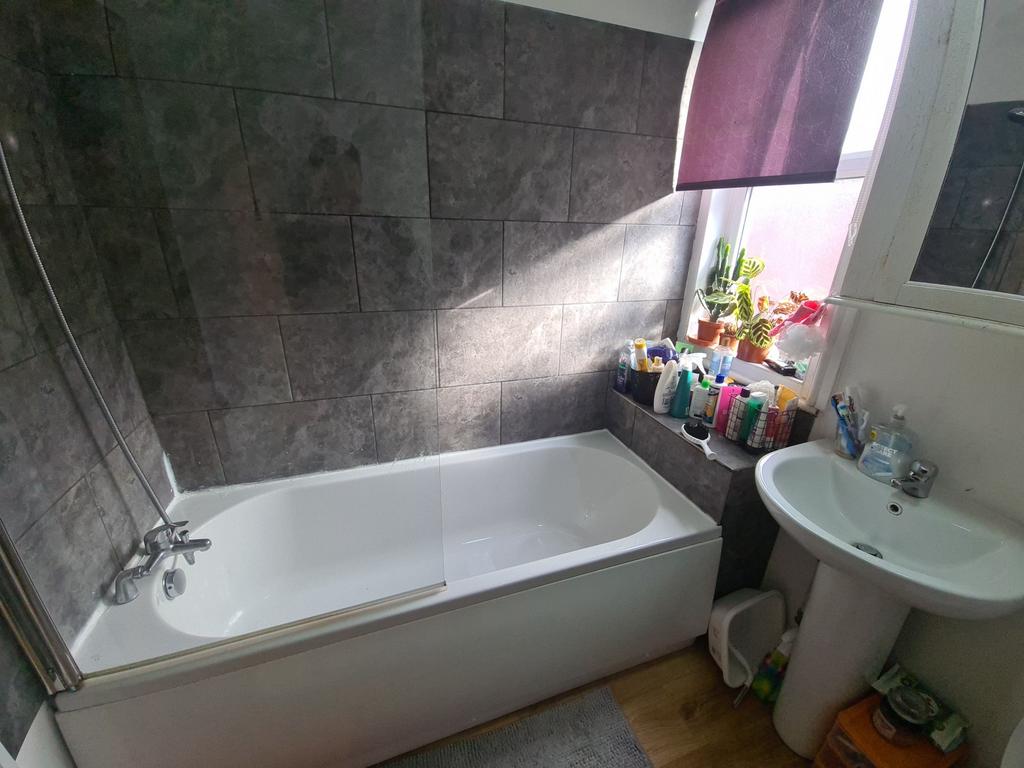 A clean and well-maintained bathroom featuring ...