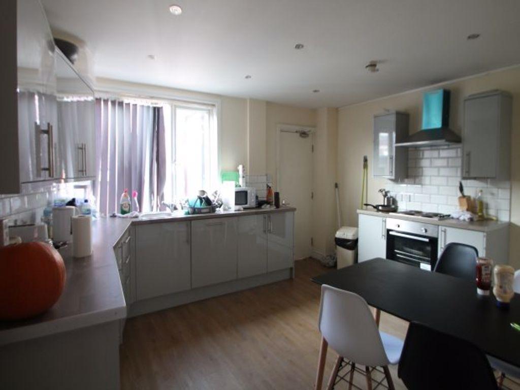 Bright and modern kitchen with ample natural li...
