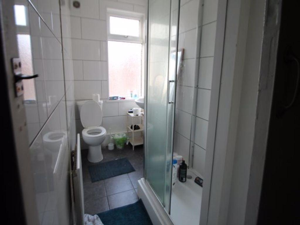 A clean and well-maintained bathroom with a lar...