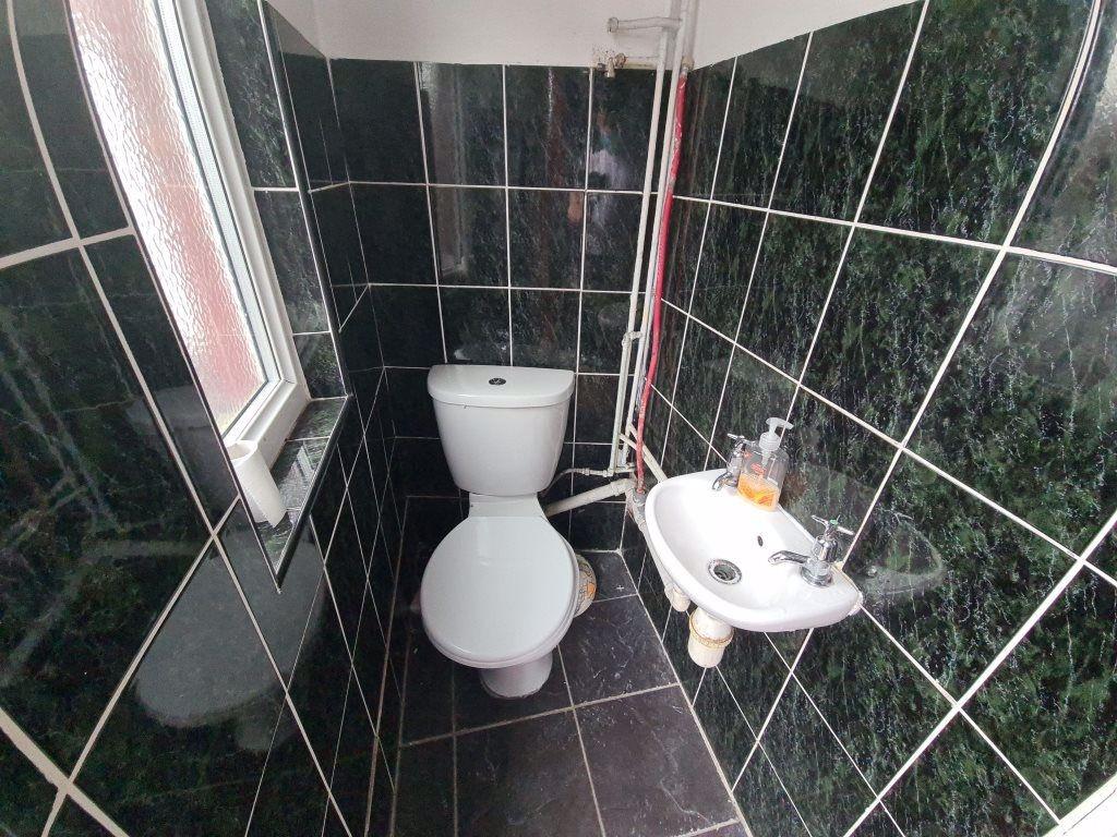 A well-maintained bathroom featuring a toilet a...