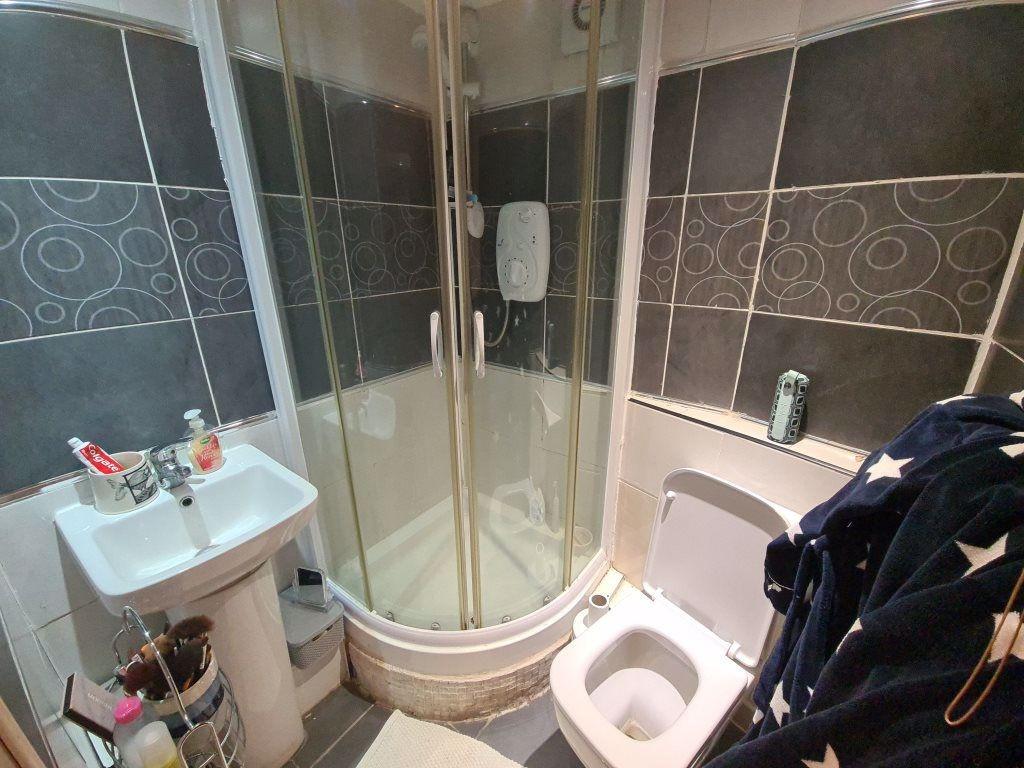 A clean and modern bathroom featuring a spaciou...