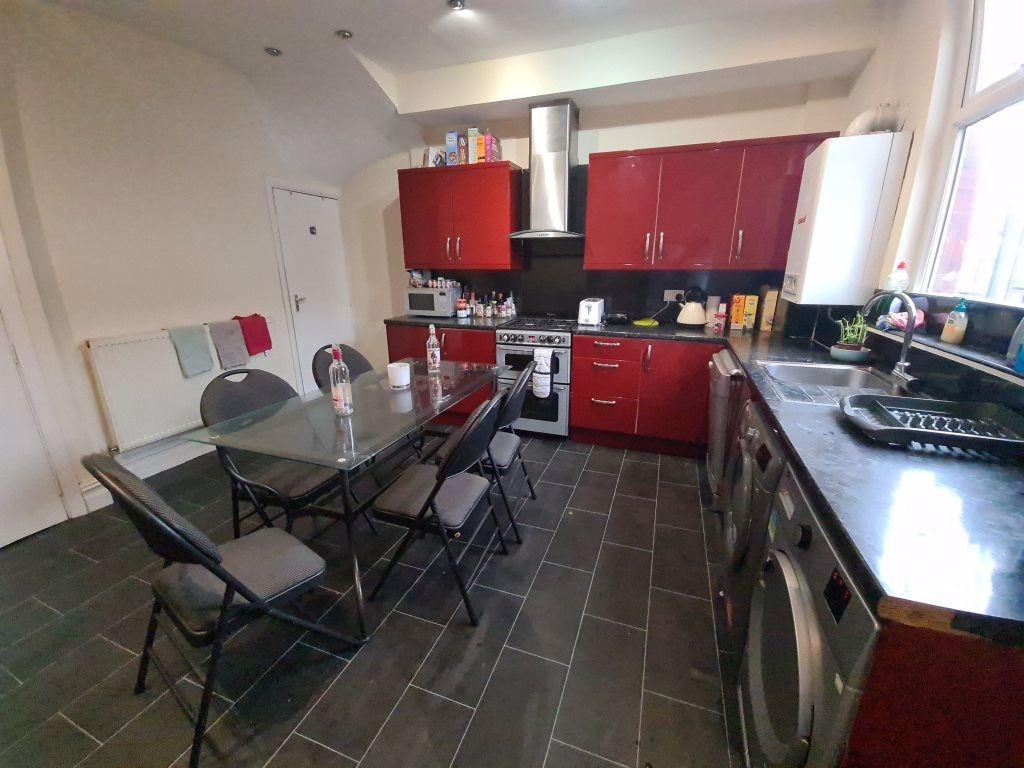 A well-equipped and tidy kitchen with ample nat...