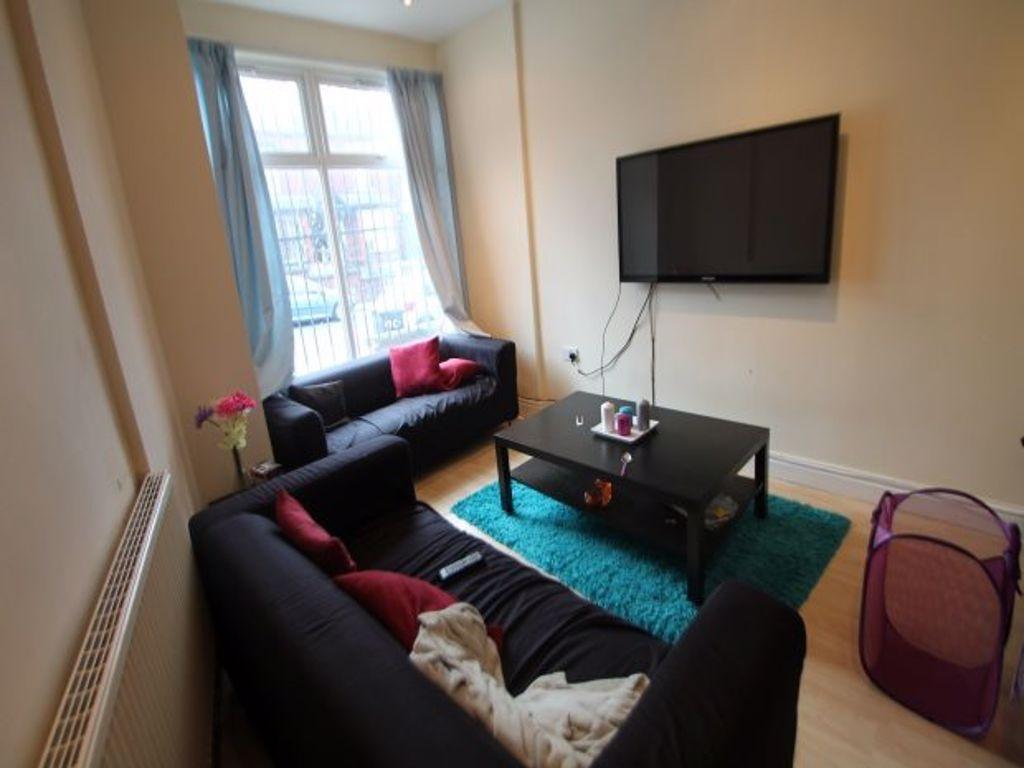 A modern, well-lit living room featuring comfor...