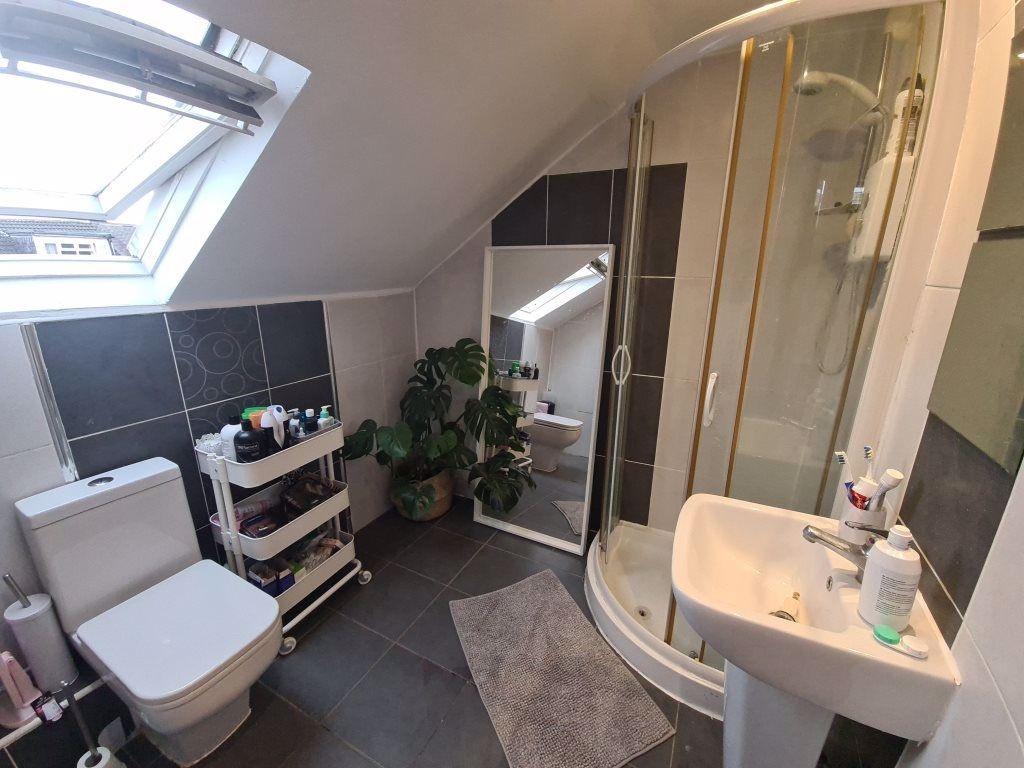 A modern, clean bathroom suite featuring a spac...