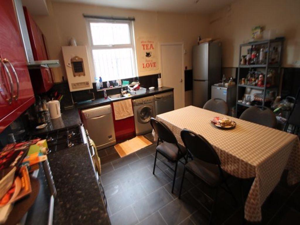A well-maintained kitchen with ample workspace,...