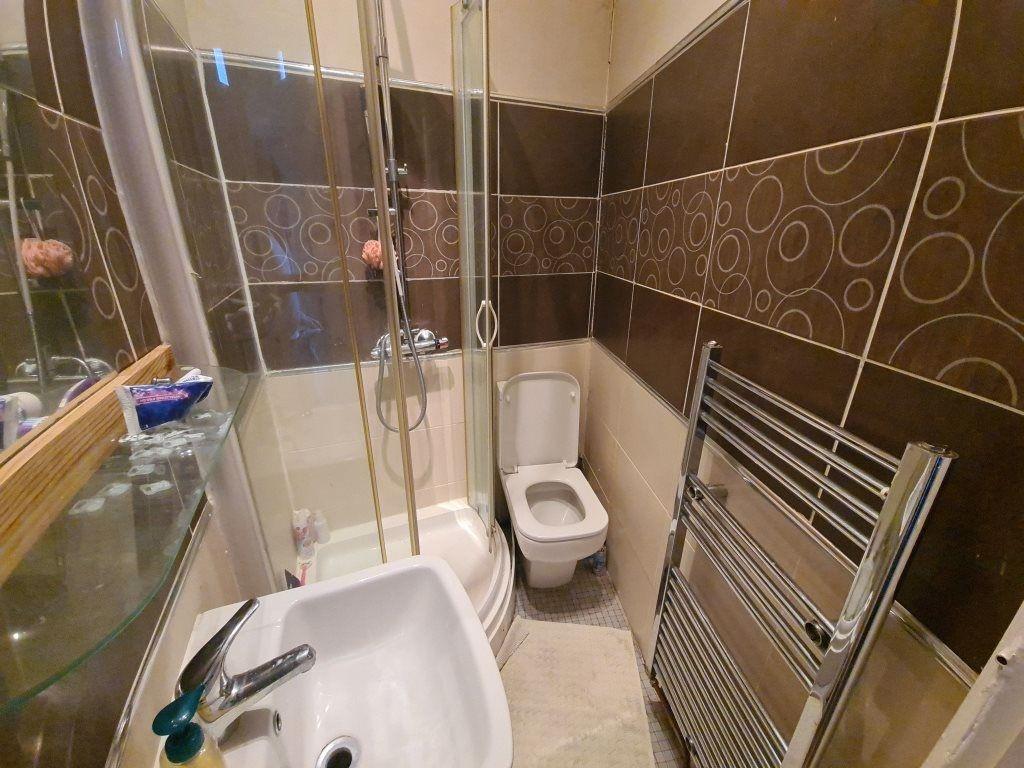 A clean and modern bathroom featuring a spaciou...