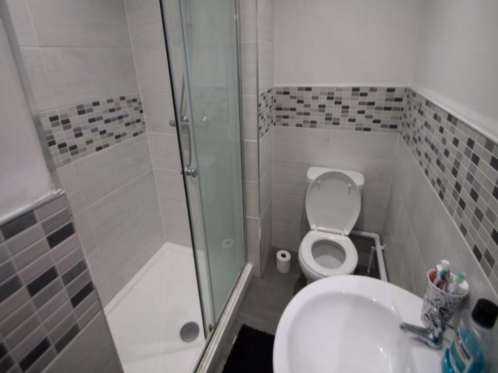 A clean and well-maintained bathroom with a lar...