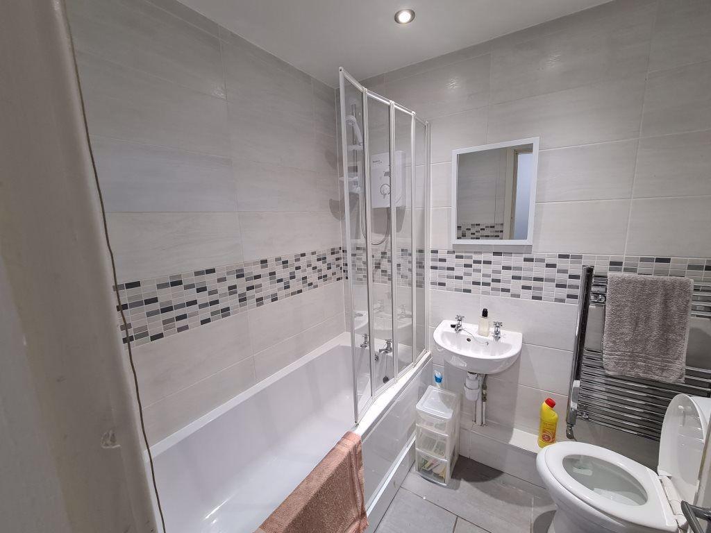 A clean and well-maintained bathroom with a lar...