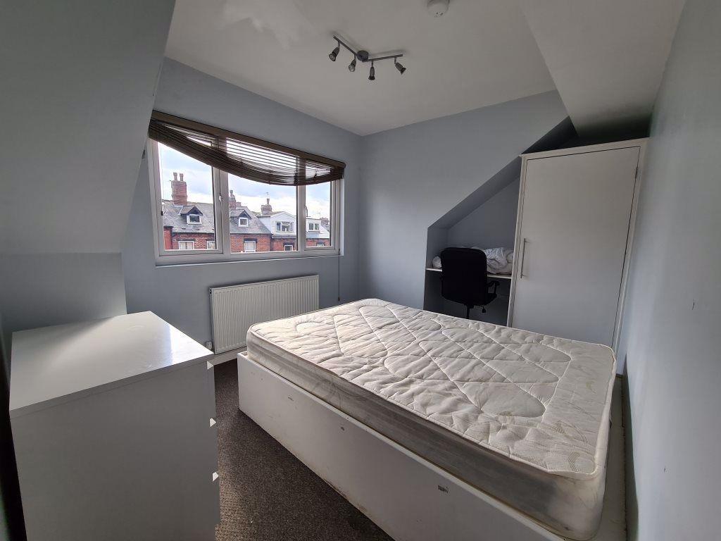 Bright and spacious master bedroom featuring a ...