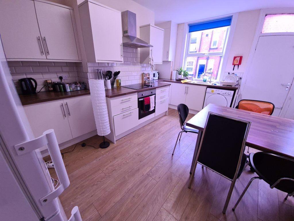 Bright and modern kitchen with ample natural li...
