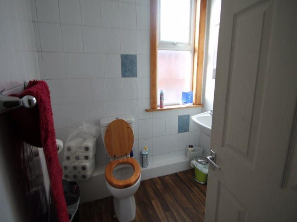 A clean and well-maintained bathroom featuring ...