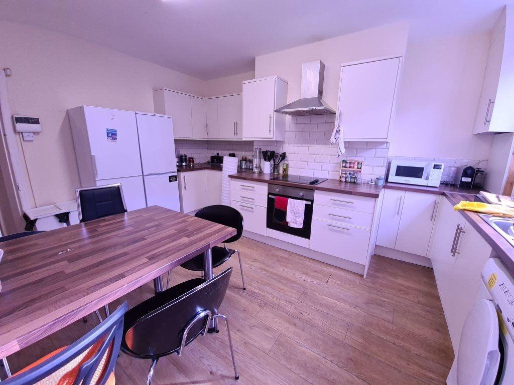A bright and modern kitchen with ample workspac...