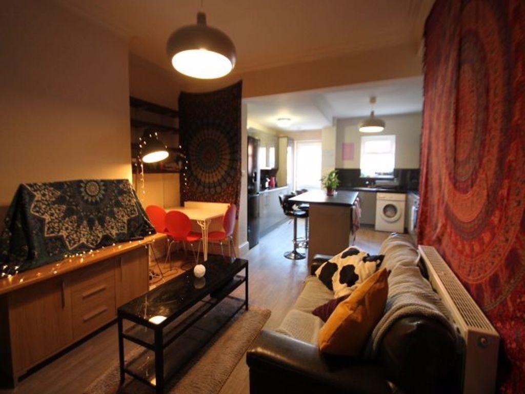 A spacious and welcoming living room with ample...