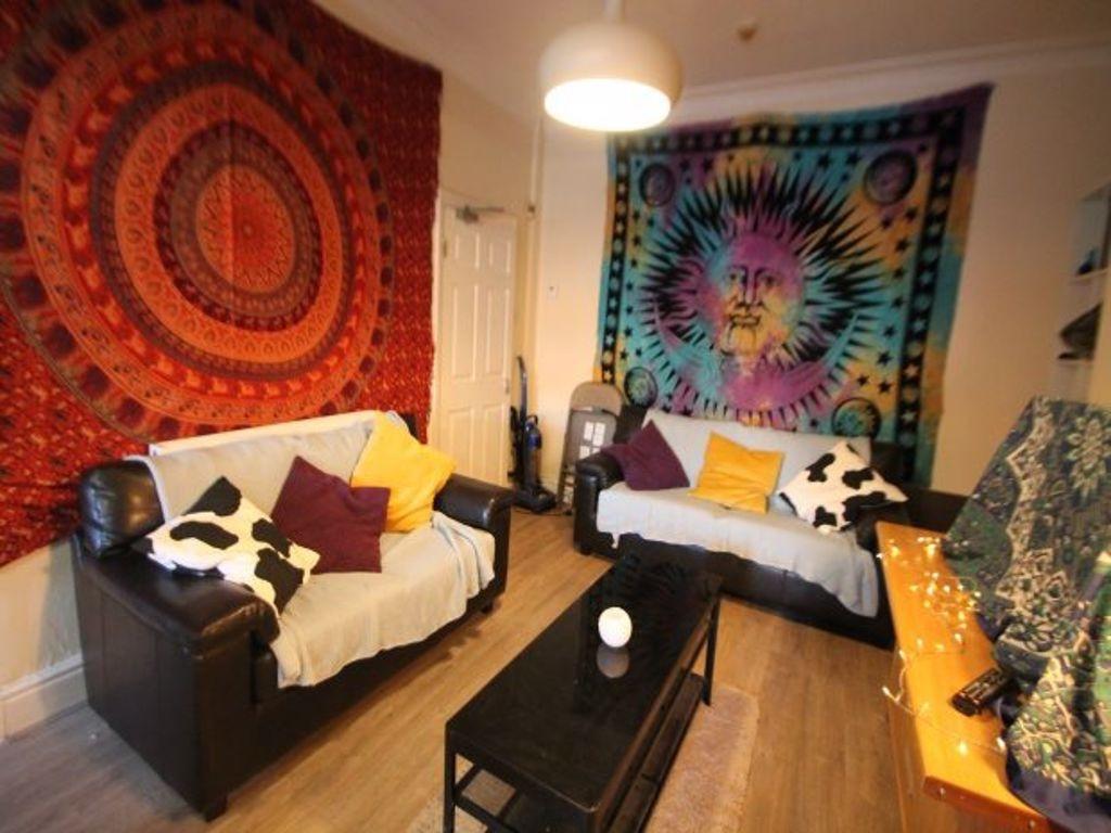 A cozy, well-maintained living room featuring c...