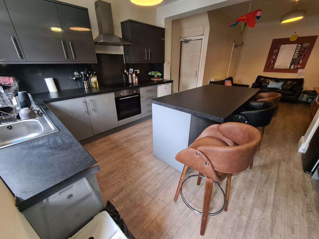 A modern, well-maintained living room with ampl...