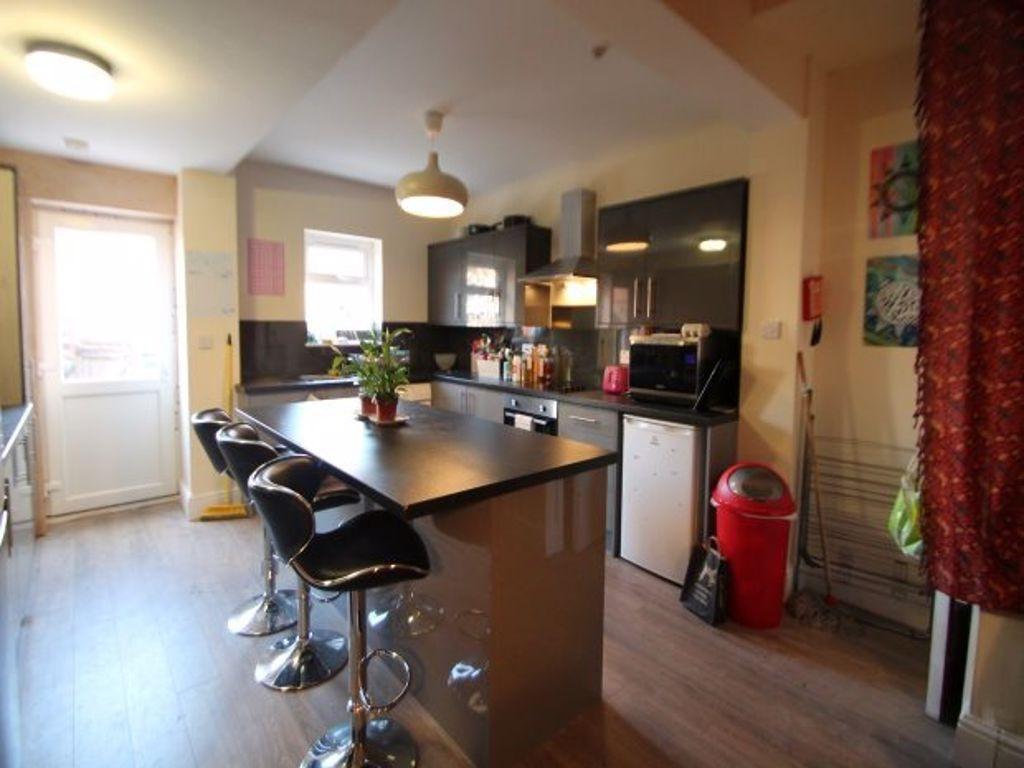 A modern and well-lit kitchen featuring a centr...