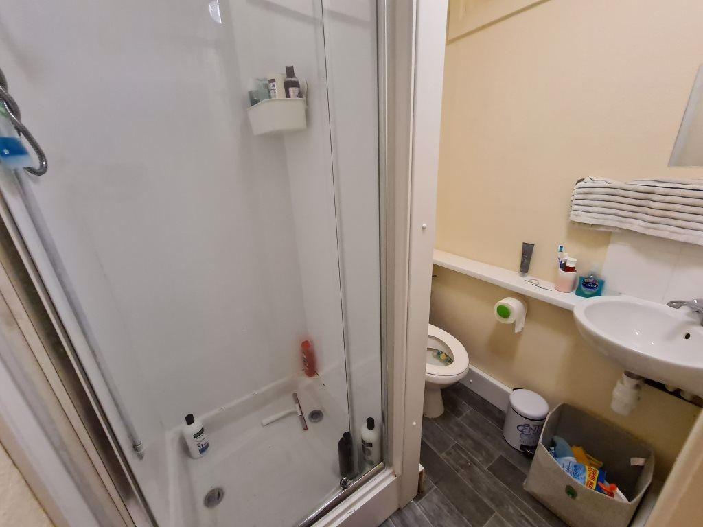 A clean and well-maintained bathroom featuring ...